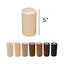 A variety of skin-toned binding tapes are displayed in rolls, with the main roll being 5 inches wide. The colors range from light beige to dark brown and black.