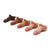 A collection of STP devices with varying skin tones, designed to resemble a male penis, arranged in a row.