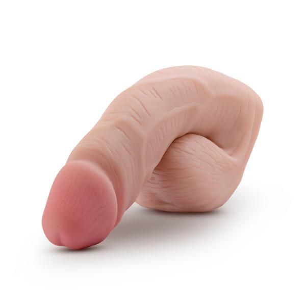 The Performance 5 inch Packer a realistic elastomer packer with a soft skin texture and a tinted head, designed for comfort and discreetness, front view.