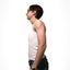 Side view of a white person with glasses wearing a white long tank binder