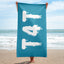 Beautiful blue T4T towel at the beach