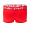 Back view of red  3" inseam boxer briefs with a white 'Cake Bandit' waistband on a white background