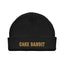 Black beanie with gold cake bandit embroidered on it