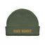 Green beanie with gold cake bandit embroidered on it