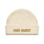 Cream beanie with gold cake bandit embroidered on it