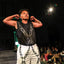 showing strength on the runway in chain harness mesh shorts