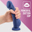 Gender Euphoria in a blue silicone toy with powerful suction cup base with a hand around it to show size
