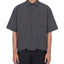 Front view of the Distressed UHaul Button down on a person