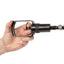Hand holding the black handle of the Toy Boy Pump Kit by Transguy Supply on a white background