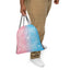 drawstring trans flag bag front in hand hanging at side