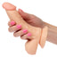 The doctor dildo curved for pleasure side view in hand