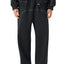 trans person wearing contrast stitching sweatpants front