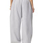 non-binary person wearing grey contrast stitching sweatpants back