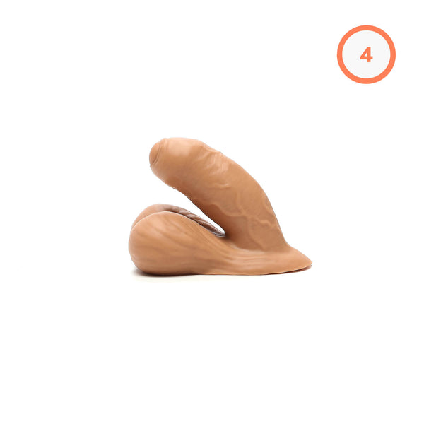 A realistic silicone trans packer with detailed intact skin, shaped to pack 