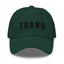 A green dad hat with the word 'TRANS' embroidered in white on the front.